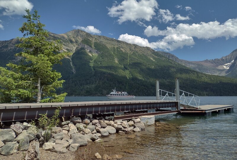 At the Canada/USA border looking east across Upper Waterton Lake, the dock and Parks boat that carries tourists between Waterton Townsite, Waterton National Park, Canada and Goat Haunt, Glacier National Park, USA.