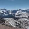 Chapman Peak (left), Lake Wurdeman, Lake Nooney, and Mt. Custer (center right) rise among a sea of peaks when looking south from the shoulder of Mt. Carthew, almost July of a high snowpack year.