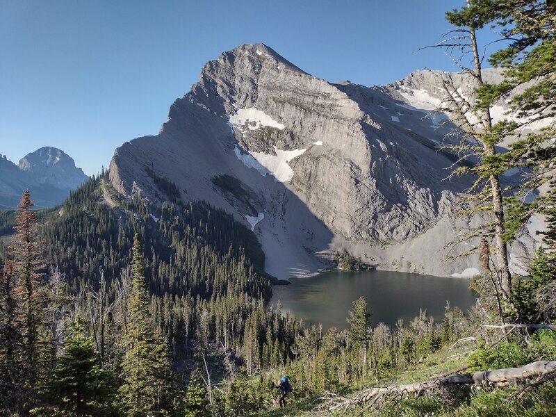 Window Mountain Lake seen looking south at the top of the switchbacks.  Mt. Ward towers over the lake.  On the far left in the distance is Crowsnest Mountain.  All on a perfect July morning.