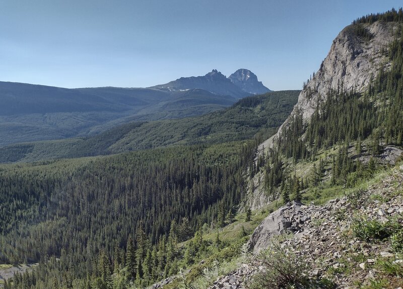 Seven Sisters and Crowsnest Mountain in the distance looking southeast from the trail just east of Racehorse Pass.