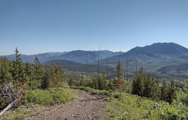 Forested hills and the valley below to the northeast of the north end of Willoughby Ridge, as the trail descends from the ridge.