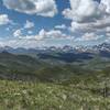 A panorama of snowy mountains and nearer forested hills unfolds to the west when hiking Willoughby Ridge.