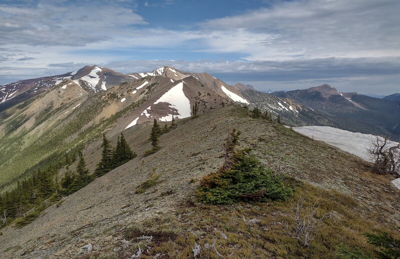 Ridges and mountains to the west with Peak #5's west ridge in the foreground.  Seen looking west from just below the summit on the west side of Peak #5, two peaks west of La Coulotte Peak (Peak #3).