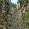 Eaton Falls in late August.  The falls drop over a crack in the cliff so are hard to see from this angle.