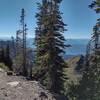 From the Lincoln Peak ridge crest, the view down the north side of the ridge with Lake McDonald in the distance.