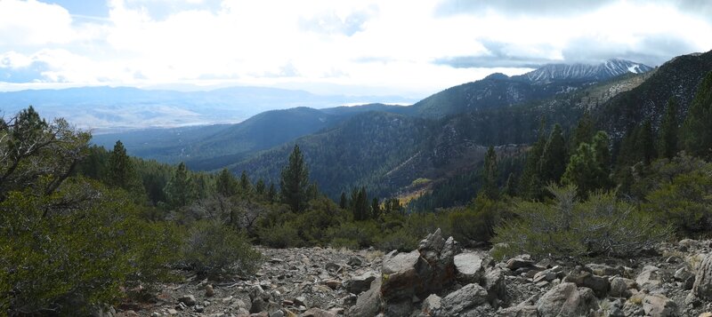 8,111 feet elevation; Panoramic view from overlook (N39° 22.006' W119° 53.167'); Cloud shrouded Mt Rose in the background. Washoe Lake in the background.