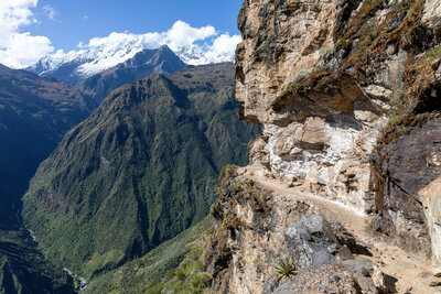 A precarious section of the trail cut into the vertical rock.