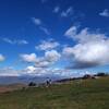 People on, and clouds over, Bearwallow Mountain.