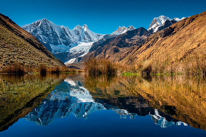 Jahuacocha Lake in the Cordillera Huayhuash Peru. This trek is organized by Peruvian Mountains Company, a specialist in trekking expedition tours  in the Cordillera Blanca, Cordillera Huayhuash in Cusco, Peru.