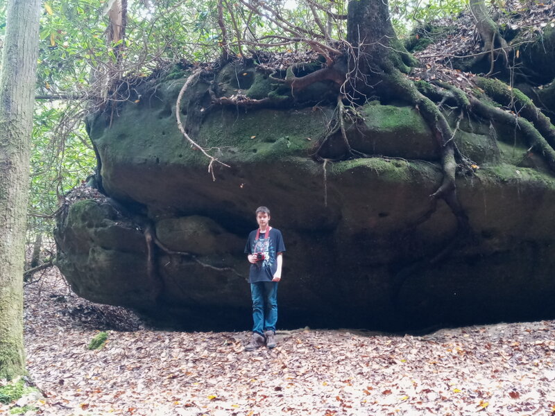 Cool tree root formation in the cut coming up from the Lake View Trail up towards Hazard Cave, person shown was 5'10" for size reference.