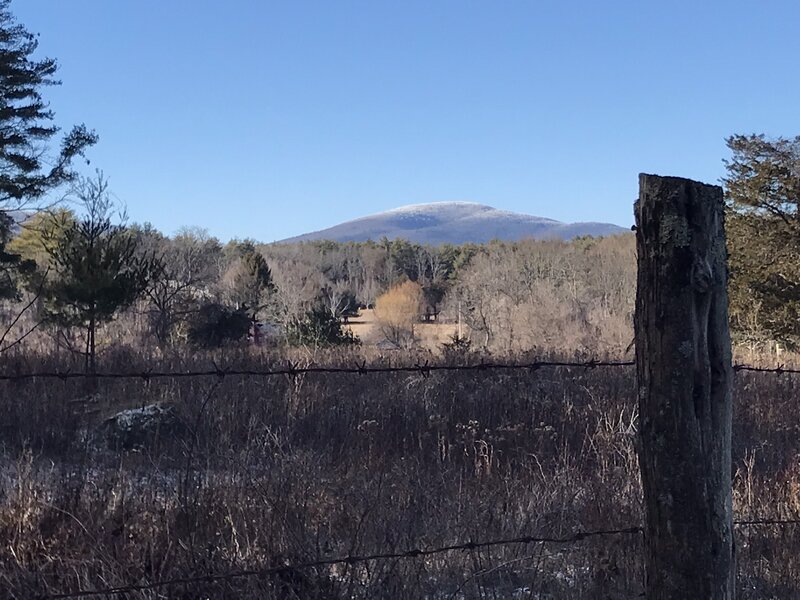 Frosted hills beyond the fields.