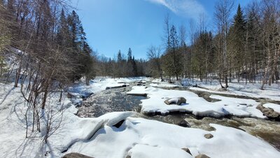 The ice on the river is starting to melt.
