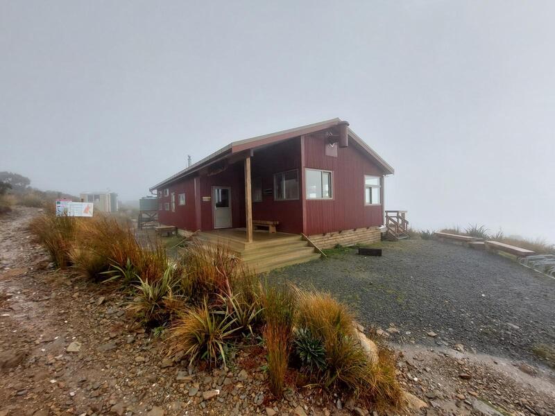 Moonlight Tops Hut sitting in the fog.