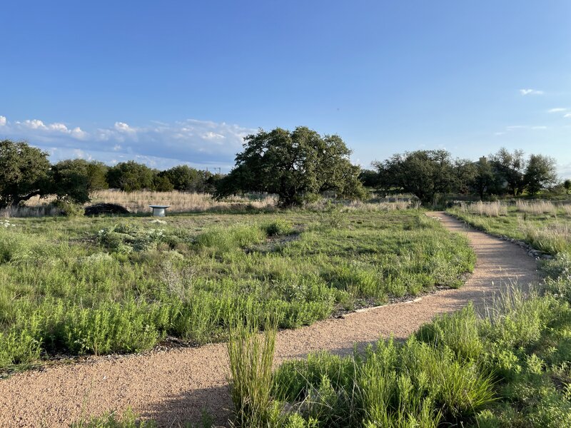 The half-mile decomposed granite walking trail wraps around a wildlife watering station and wildlife brush pile.