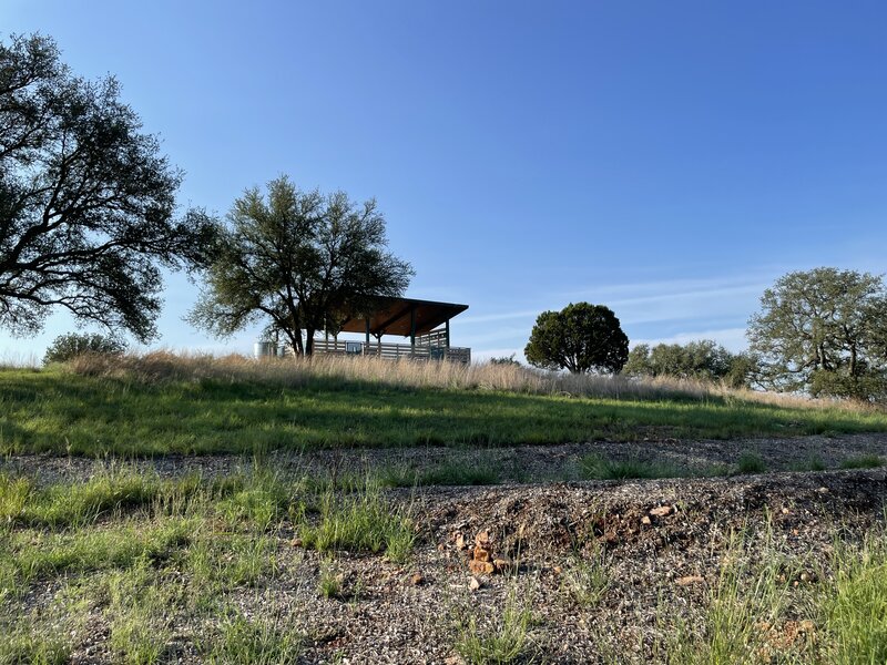 A view of the observation deck with a contour swale, a permaculture water conservation technique, in the foreground.