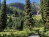 The path to Lower Twin Lake runs through high meadows beneath cliffs of the Great Divide.