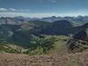 From Lineham Ridge, the trail on the south side of the ridge is etched in the shale at the foot of the Great Divide's rock wall, and at the edge of the green sub-alpine meadows below.