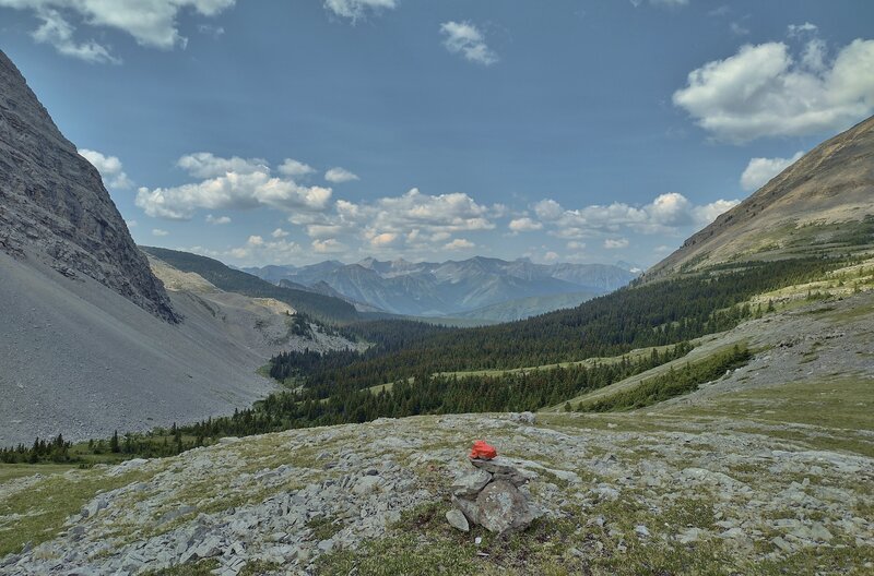 At Fording River Pass on the Great Divide, looking west into British Columbia. Orange topped GDT cairns show the way.