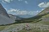At Fording River Pass on the Great Divide, looking west into British Columbia. Orange topped GDT cairns show the way.