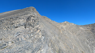 Taken from the top of the saddle.  Summit is on the far right with snow below it.