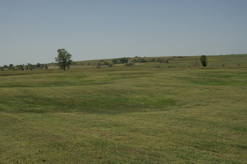 The remains of a Hidatsa Village can be seen along the trail. There are circular mounds and depressions that indicate roughly 113 earth lodges once stood here.