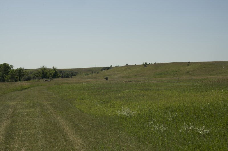 The trail dead ends at the historic site property line.