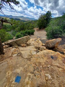 Blue square and black diamond difficulty lines on the steep descent.