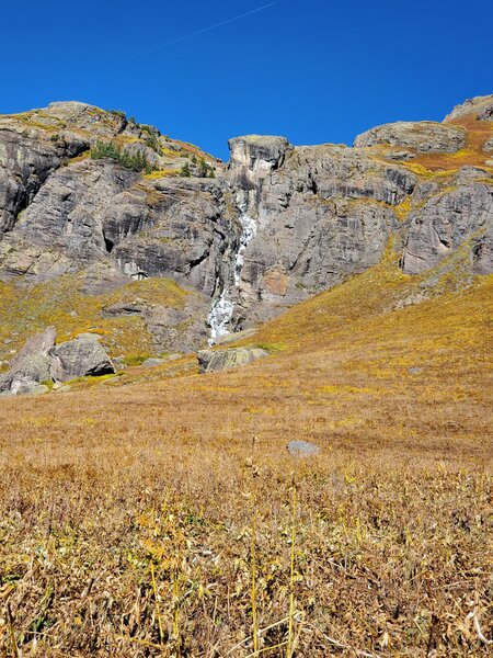 Water cascading down the cliffs.