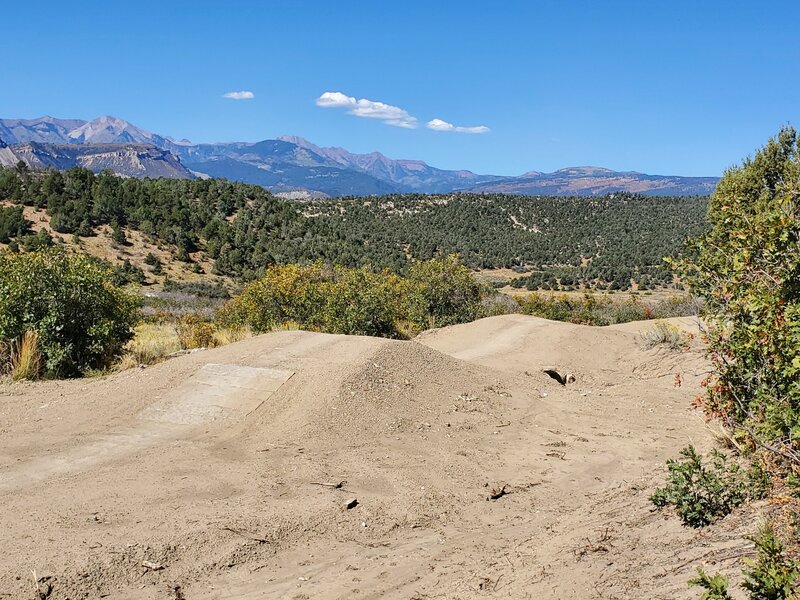 Some armored and un-armored jumps with the La Plata Mountains as distant scenery.