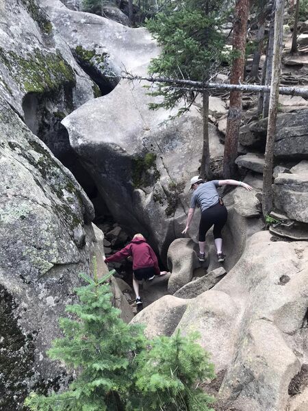 Climbing down into the slot.