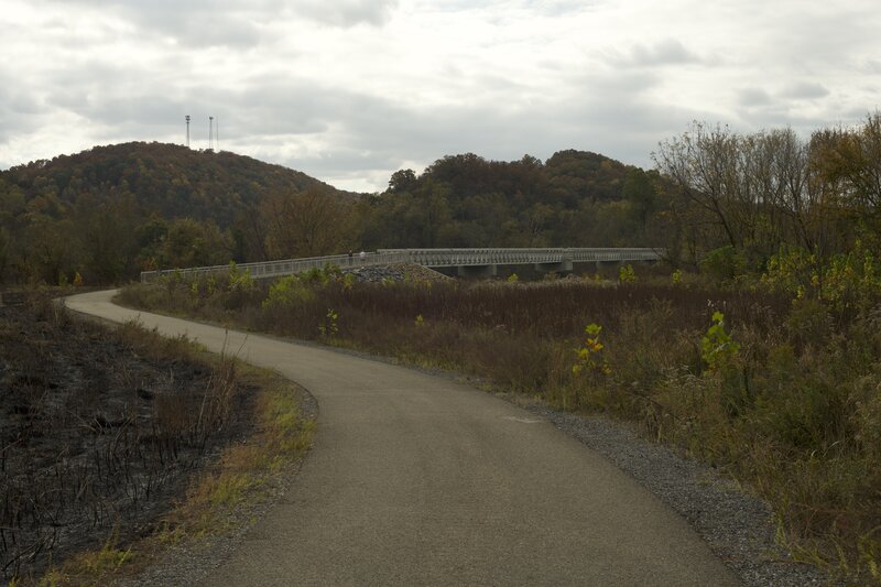 The trail makes its way to a bridge that crosses the French Broad River and provides access to the Island Loop Trail.