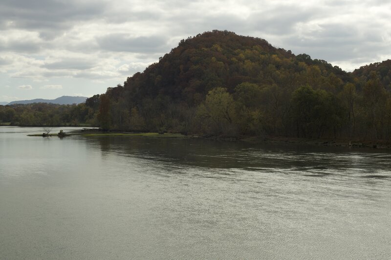 The mountains and hillsides are lit up in the fall as the leaves change color.