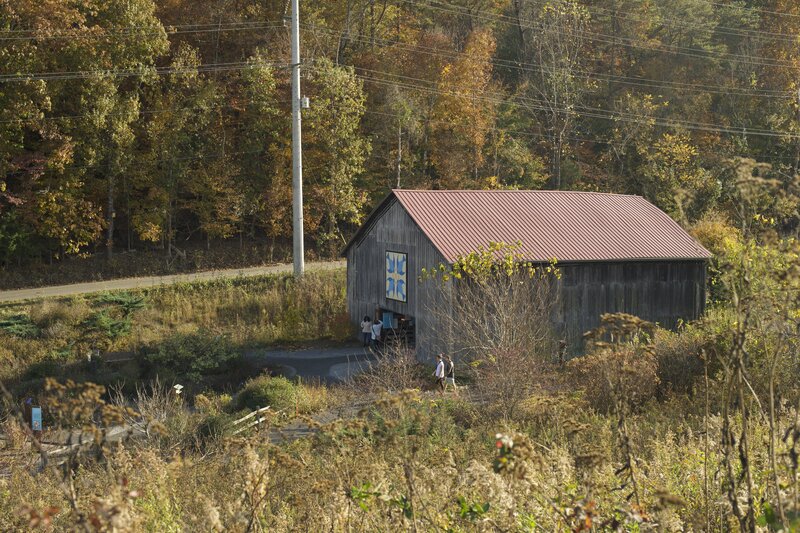 As the trail descends the hillside, you get a good view of the Bluebird Barn.