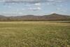 The trail passes through farmland in the valley with the Cumberland Mountains in the background.