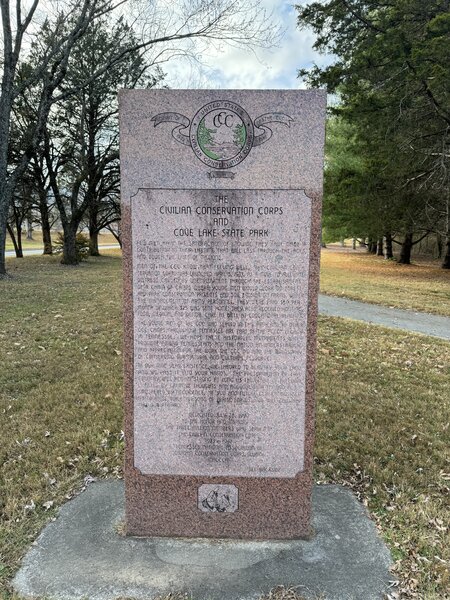 A stone memorial commemorating the work that the Civilian Conservation Corps did in Cove Lake State Park sits close to the visitor center along the trail.