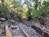 Narrow canyon with water.