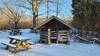 Play house and picnic tables near Jacob Moery Cabin in the winter.