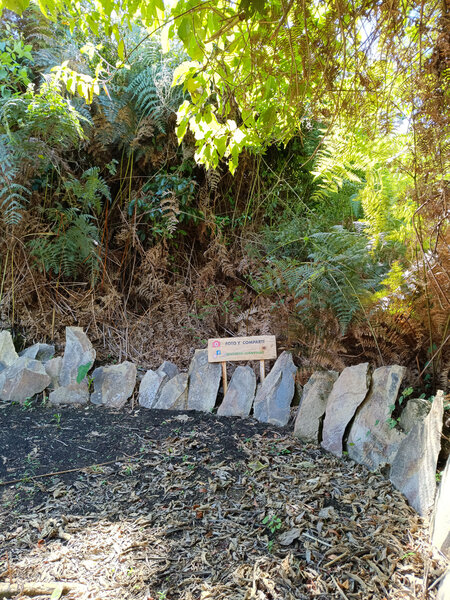 Stone  beside the trail in a turn.