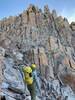 Looking up at the wall to climb before the summit.