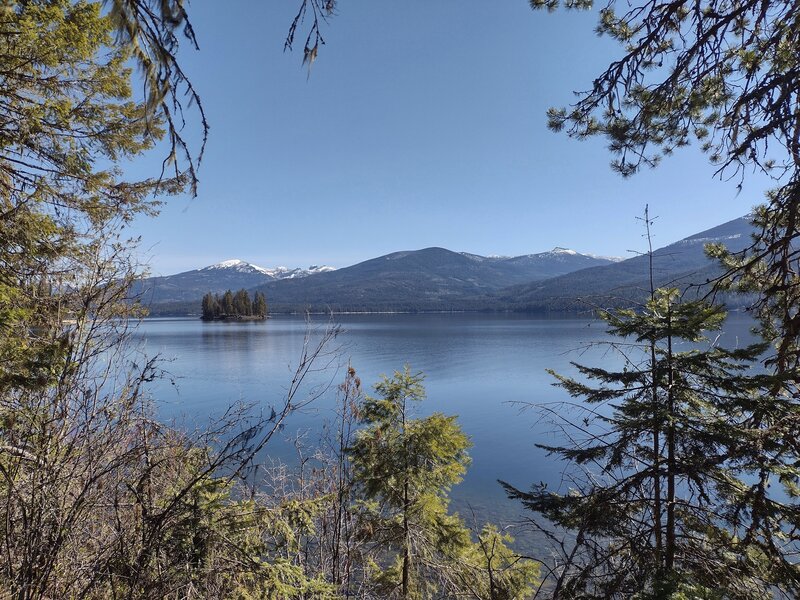 Twin Islands of Priest Lake. Selkirk Mountains in the distance. Seen looking north-northeast on Lakeshore Trail.