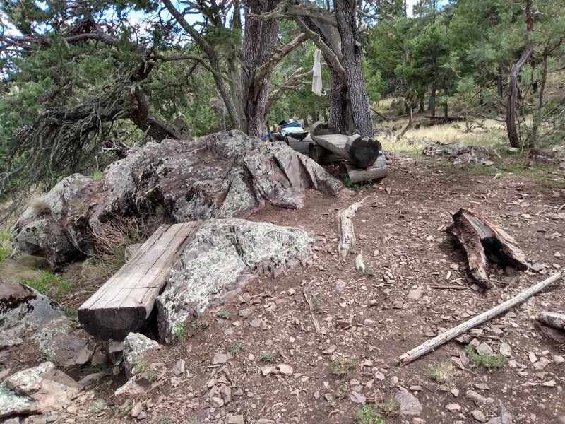 Log benches provide a welcoming place for lunch after the trail ascends the walls of Cedar Creek Canyon.