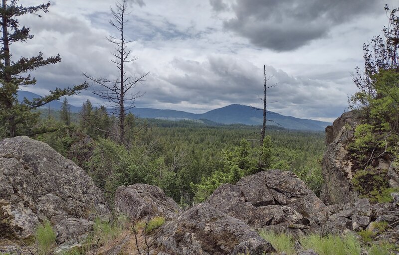 Rathdrum Mountain, center right, about 15 miles away to the west-southwest, is seen from the top of the rocky highpoint.