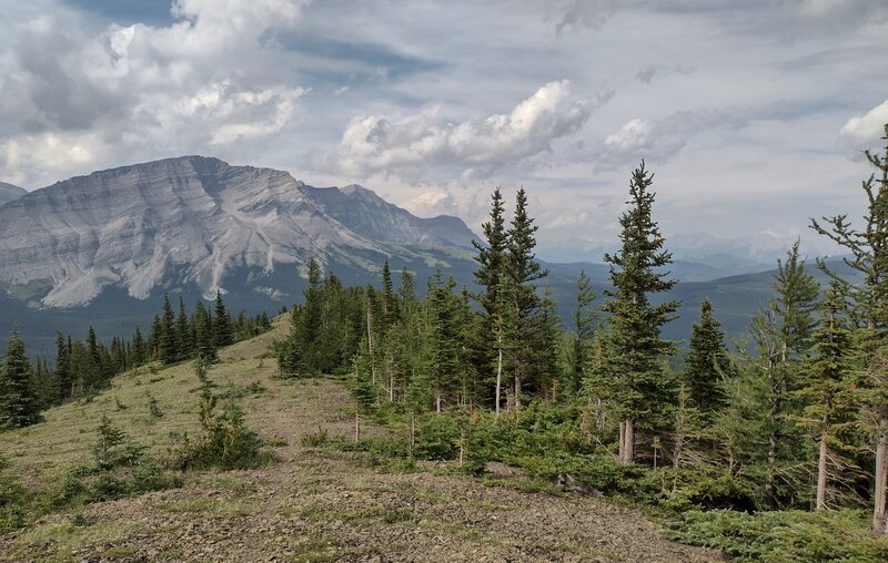Mount Etherington, 9,439 ft., on the Great Divide, is seen ahead to the north-northwest, from the Great Divide Trail as it travels along a high ridge crest.
