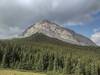 Impressive, lesser peak on the northeast shoulder of Baril Peak, 9.836 ft. Seen looking southwest from a grassy knoll along the Great Divide Trail. Baril Peak is hidden a ways behind this lesser peak.