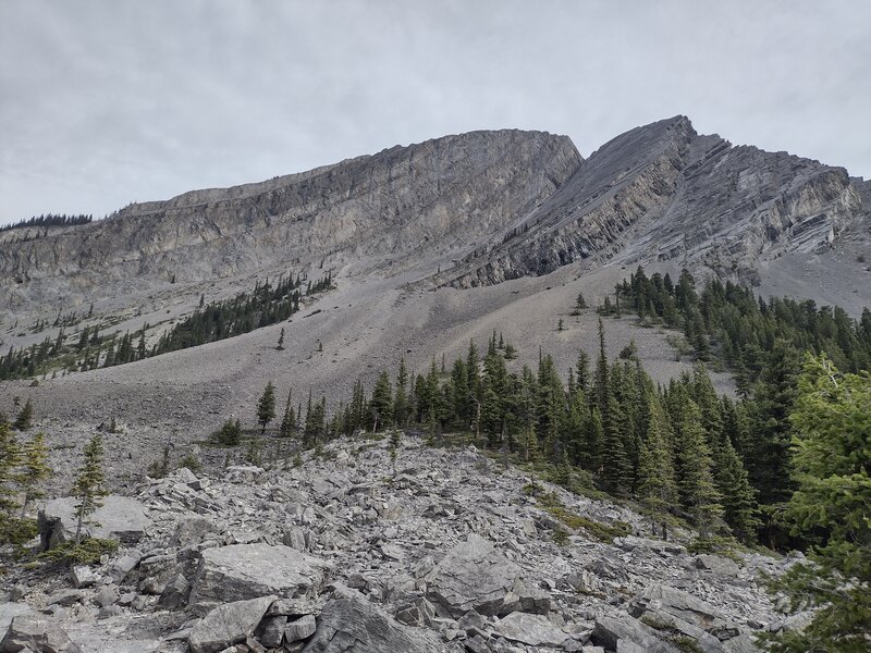 Looking up at Mount Indefatigable, the trail goes through remnants of its famous rock slide.