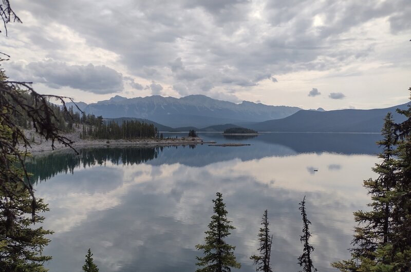 Looking east across Upper Kananaskis Lake, the Elk Range of mountains, is seen in the distance.