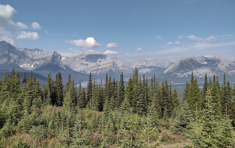 Mt. Sarrail, 10,400 ft. (left), Mt. Lyautey, 9,990 ft. (center left), Mt. Putnik, 9,645 ft. (center right), and Mt. Indefatigable, 8,760 ft. (right), rise above Upper Kananaskis Lake below. Lower Kananaskis Lake (right) is below Mt. Indefatigable.