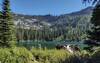 Snow Lake, a pretty alpine lake, is in a cirque at the foot of an unnamed peak, and rocky walls of the surrounding ridges.