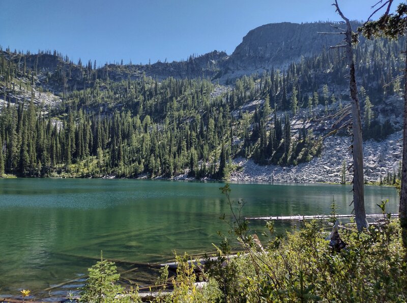 An unnamed peak and the steep, rocky ridges leading to it, rise above the south side of Snow Lake.