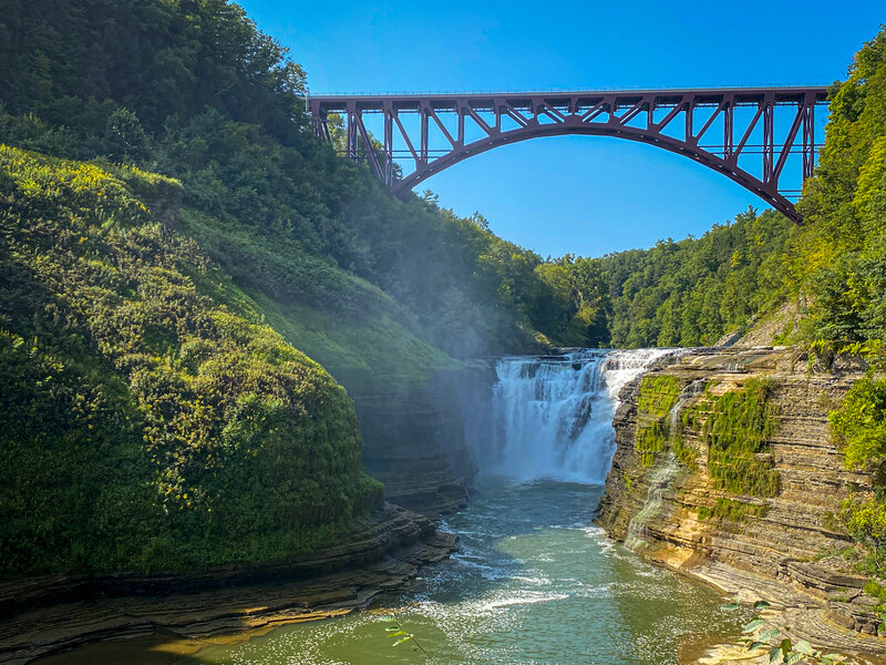 Upper Falls at Letchworth State Park flowing underneath Genesee Arch Bridge.